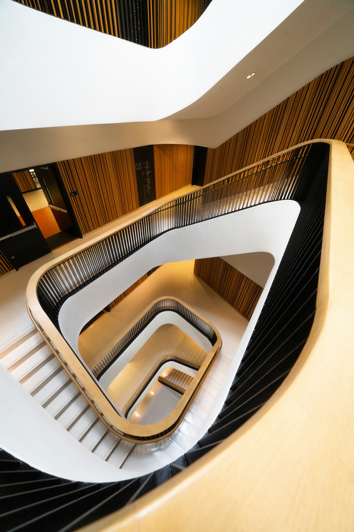 A sculptural staircase connecting levels of a modern building