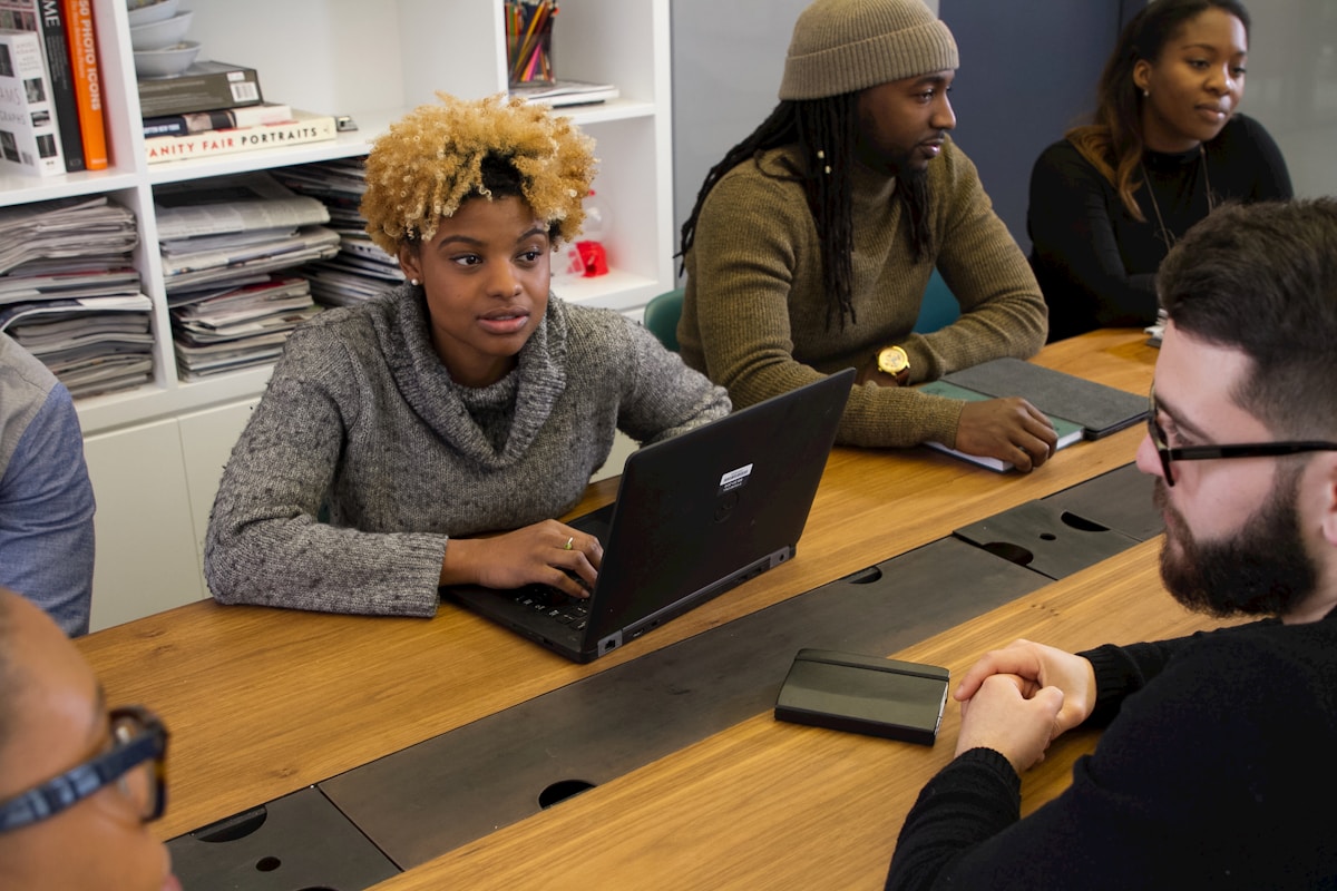 Colleagues working together around a table